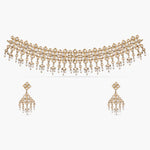 A picture of an Indian artificial jewelry set with a gold-toned choker necklace and matching earrings with Cubic Zirconia stones.
