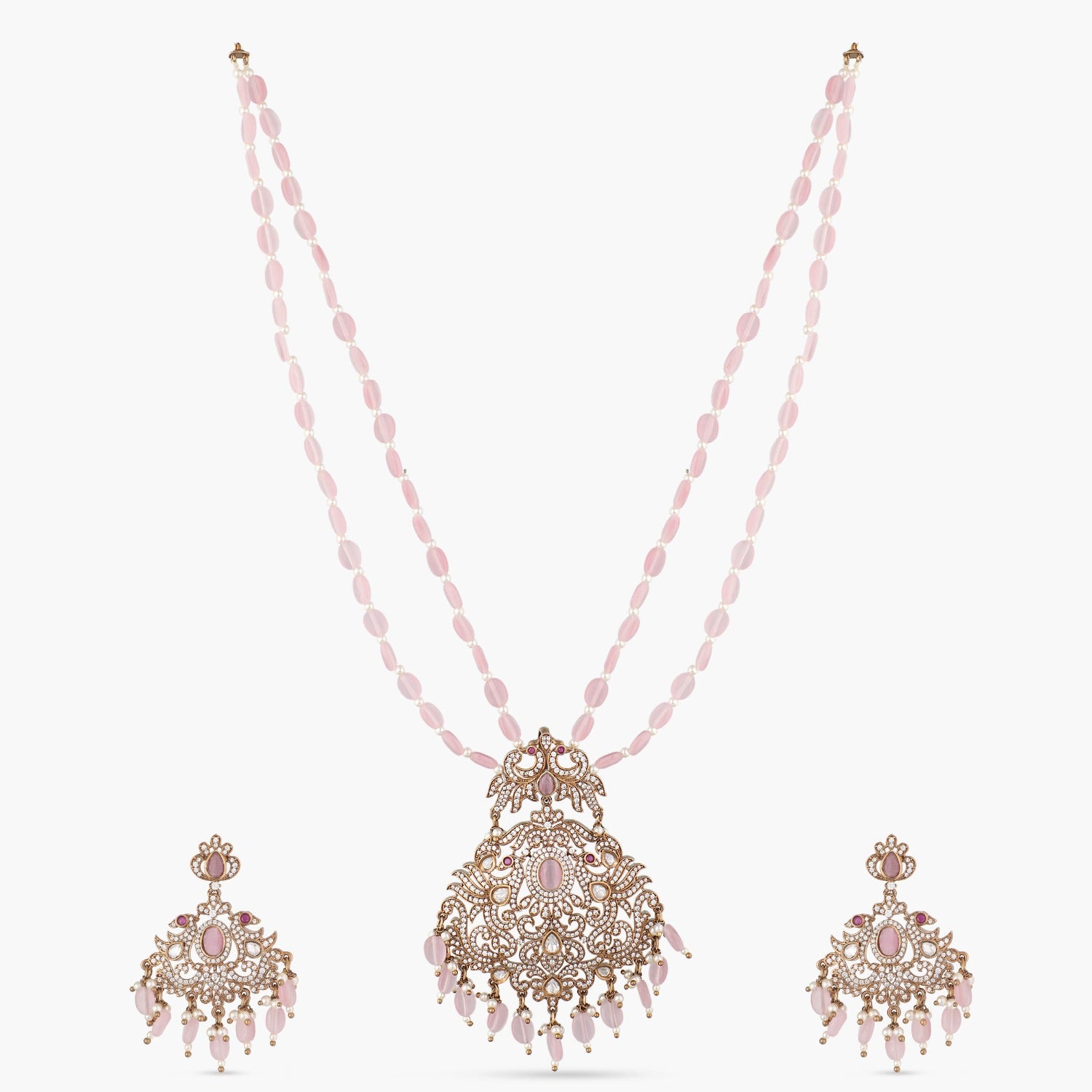 A picture of Indian artificial jewelry. It is a pink colored necklace and earring set with intricate beadwork.