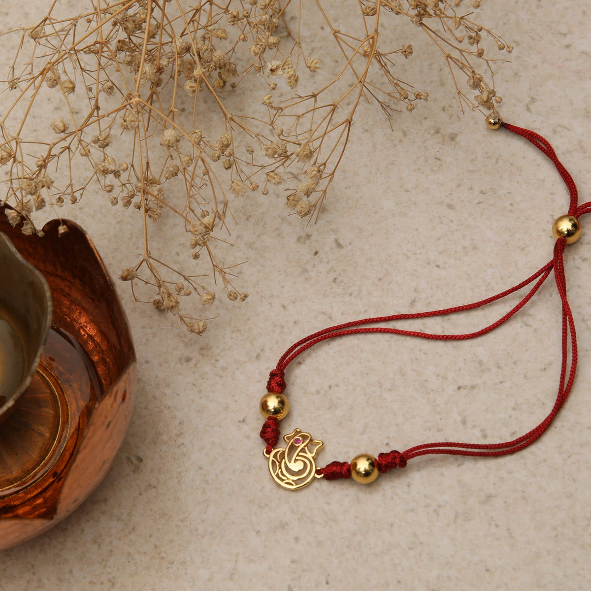 Shree Ganesha Gold Plated Silver Rakhi