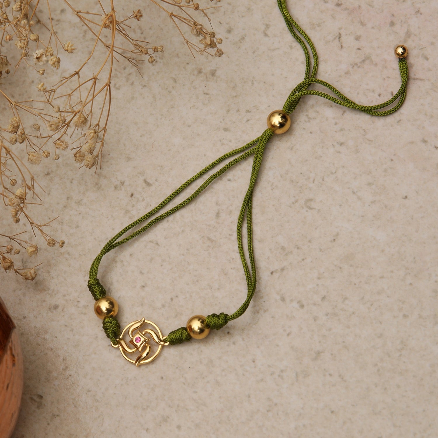 Swastik Shakti Gold Plated Silver Rakhi