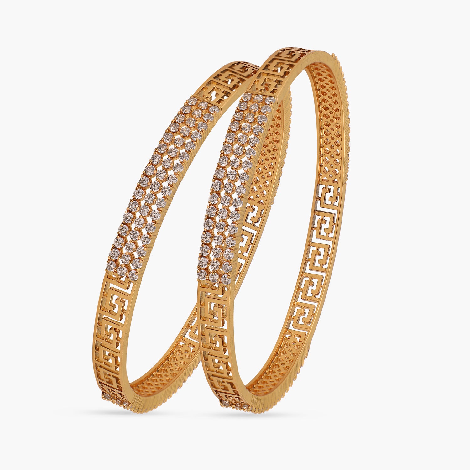  A picture of a pair of Indian artificial bangles, featuring a Greek key design with Cubic Zirconia.