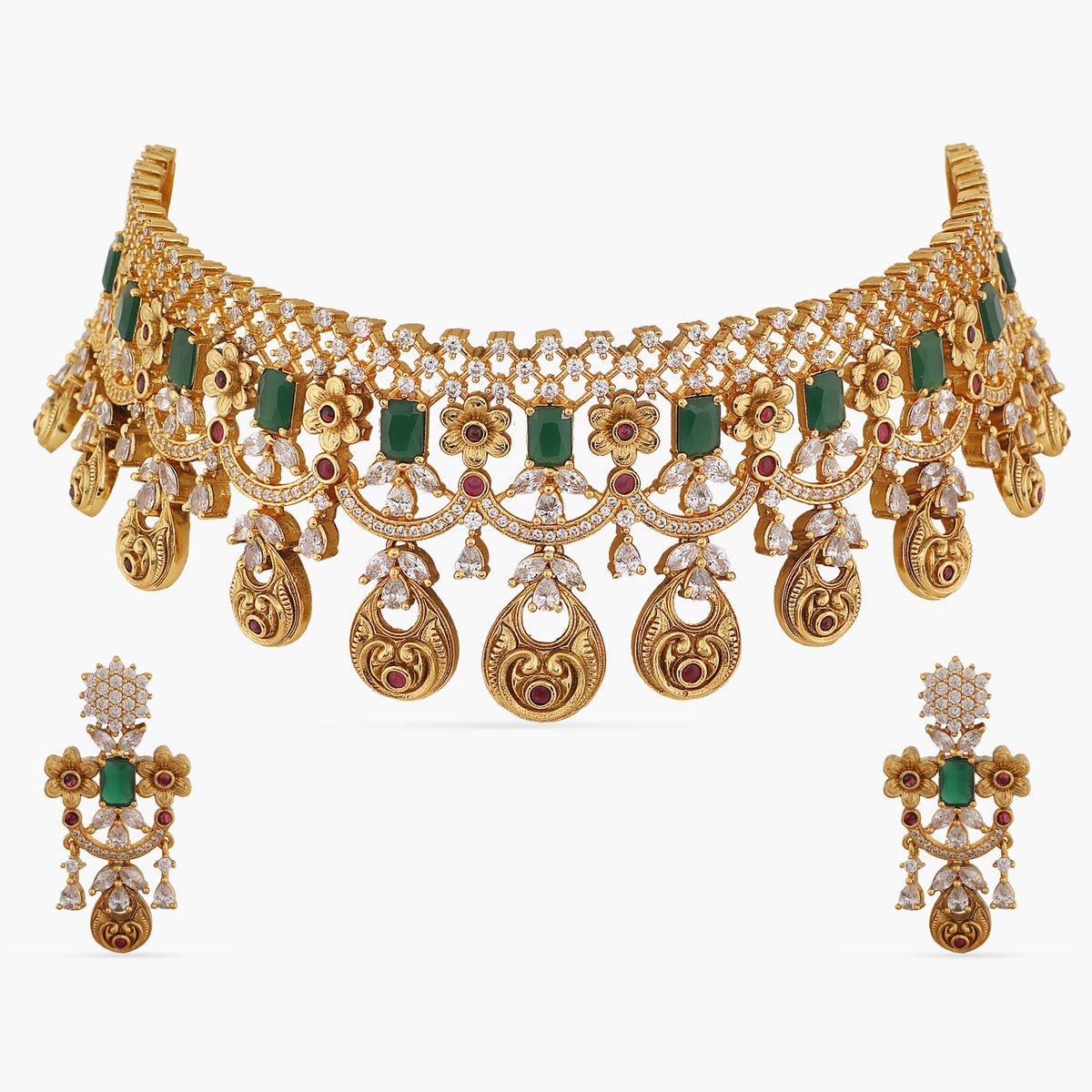 A picture of an Indian artificial gold plated choker necklace with green gemstones and Cubic Zirconia on a white background.
