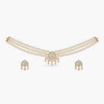 A picture of an Indian artificial jewelry set: a three layered pearl necklace and earrings featuring Cubic Zirconia and green gemstones.