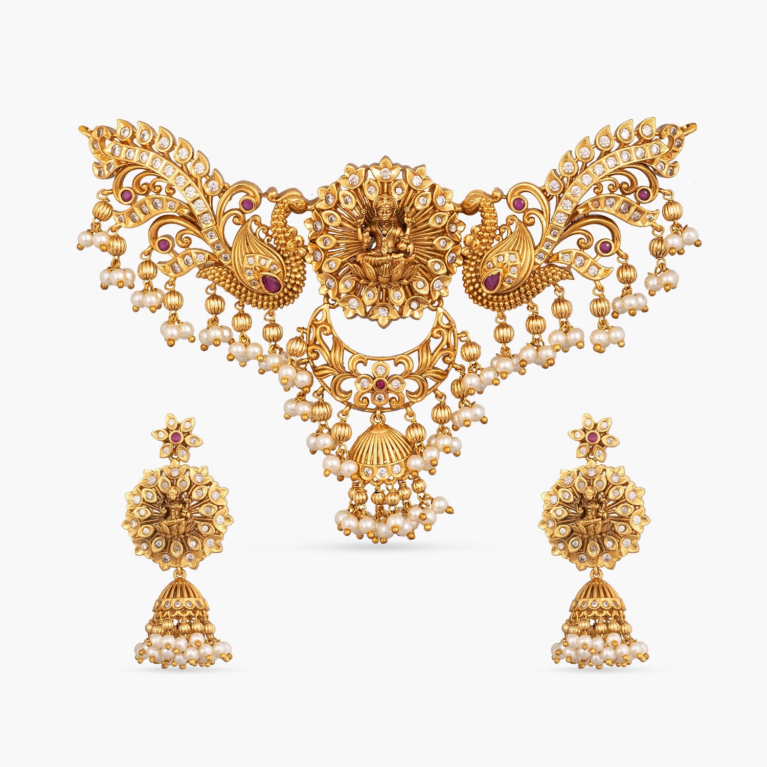 An image of an Indian artificial necklace with divine and peacock motifs and pearls on a white background.