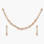 An image of an Indian artificial necklace set with a gold-toned chain, including floral motofs woth Cubic Zirconia and red gemstones.