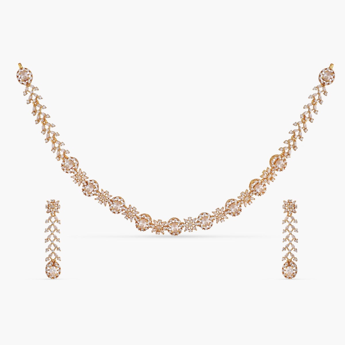 An image of an Indian artificial necklace set with a gold-toned chain, including floral motofs woth Cubic Zirconia and red gemstones.
