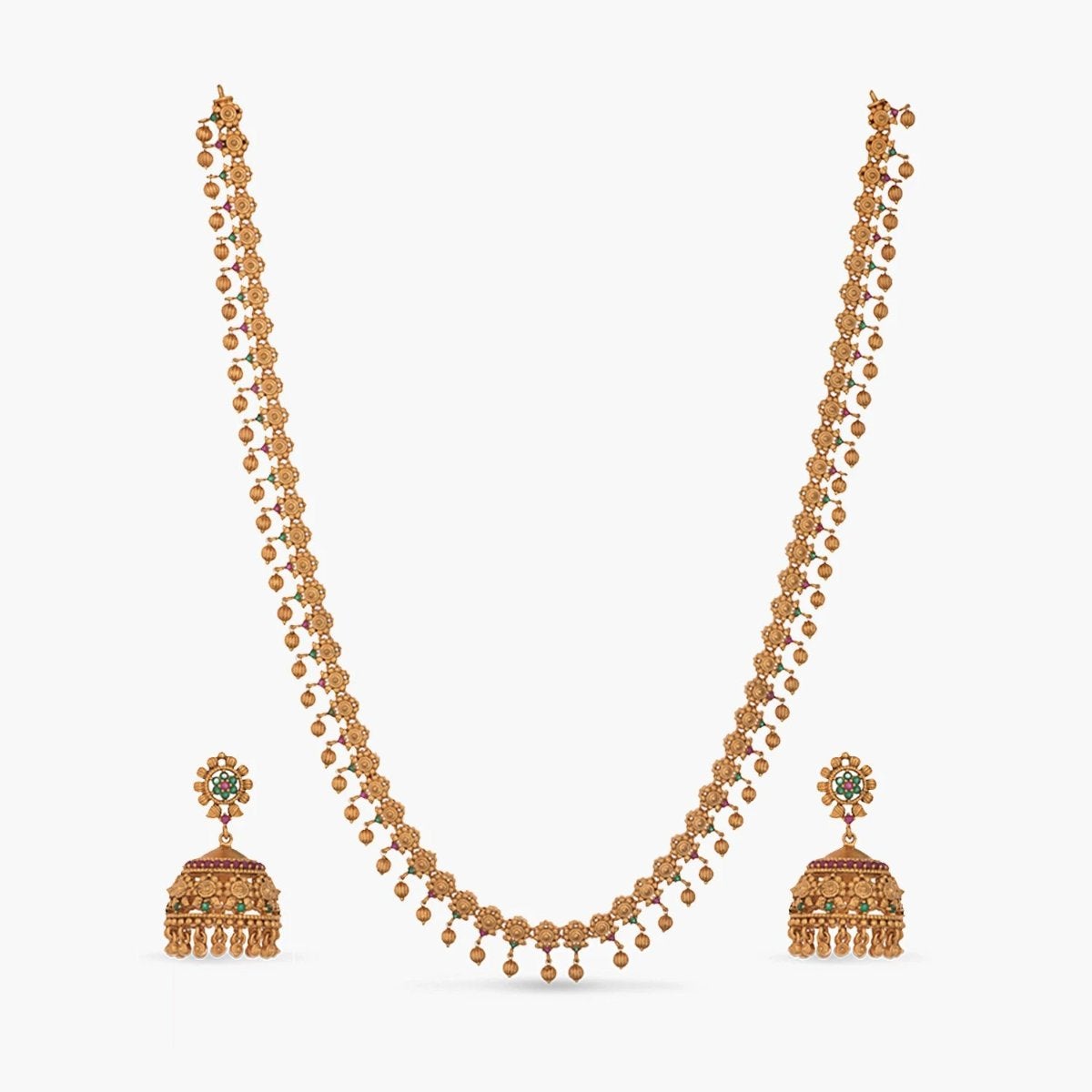 A picture of an Indian artificial jewelry set: an antique gold-colored necklace and matching earrings with intricate designs.